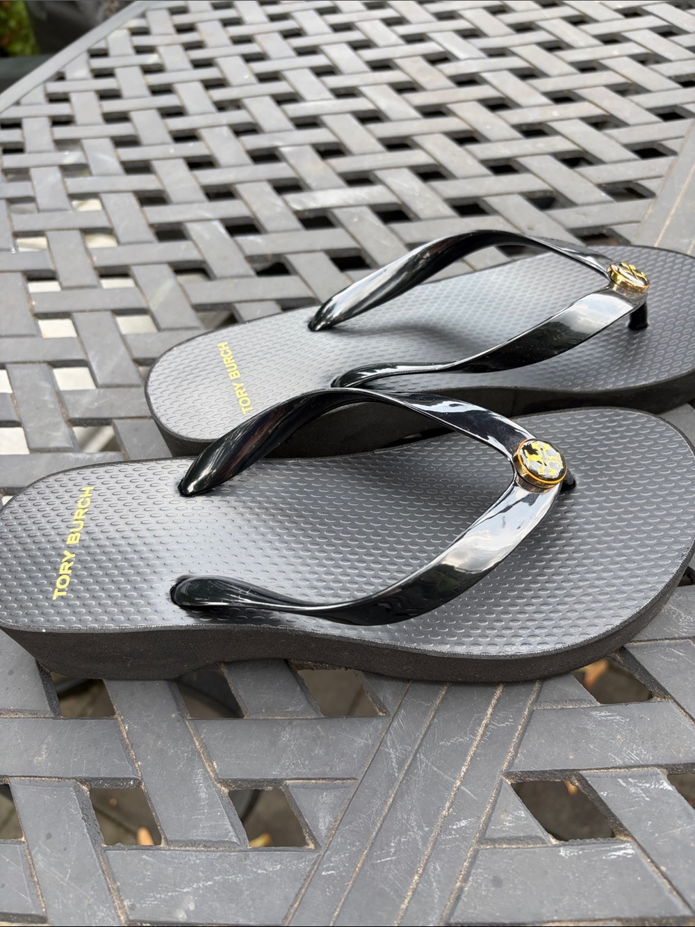 Tory Burch Black Glossy Logo Flip Sandals with Gold Emblem